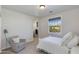 Bright bedroom with window seat and en-suite bathroom at 3838 E Devonshire Ave, Phoenix, AZ 85018