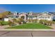 Beautiful two-story home with a brick facade, landscaping, and a large driveway at 3838 E Devonshire Ave, Phoenix, AZ 85018