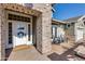 Inviting front entrance with brick columns, a white door, and a charming wreath at 3838 E Devonshire Ave, Phoenix, AZ 85018