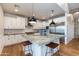 Modern kitchen with white cabinets, granite countertops, and stainless steel appliances at 3838 E Devonshire Ave, Phoenix, AZ 85018