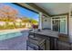 Outdoor patio with table and chairs, adjacent to pool at 3838 E Devonshire Ave, Phoenix, AZ 85018