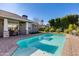 Inviting backyard pool with brick patio and grassy area at 3838 E Devonshire Ave, Phoenix, AZ 85018