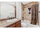 Bathroom with tub shower combination and granite vanity at 3935 E Rough Rider Rd # 1235, Phoenix, AZ 85050