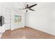 Bright bedroom with built-in shelving and ceiling fan at 3935 E Rough Rider Rd # 1235, Phoenix, AZ 85050