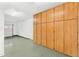 Garage interior with overhead storage cabinets and epoxy flooring at 3935 E Rough Rider Rd # 1235, Phoenix, AZ 85050