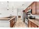 Modern kitchen with stainless steel appliances and granite countertops at 3935 E Rough Rider Rd # 1235, Phoenix, AZ 85050