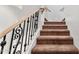 Indoor view of a carpeted staircase with ornate metal railing at 3935 E Rough Rider Rd # 1235, Phoenix, AZ 85050