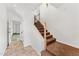 Interior staircase with wood railing and brown carpet runner at 3935 E Rough Rider Rd # 1235, Phoenix, AZ 85050