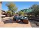 Landscaped backyard with seating and umbrella at 41019 N Congressional Dr, Anthem, AZ 85086