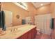 Bathroom with single vanity, shower/tub combo, and tile floor at 41019 N Congressional Dr, Anthem, AZ 85086