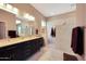 Bathroom features a double vanity, large shower and beige tile at 41019 N Congressional Dr, Anthem, AZ 85086