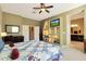 Main bedroom with ensuite bath, built-in shelving and large windows at 41019 N Congressional Dr, Anthem, AZ 85086