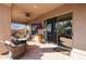 Relaxing covered patio with seating and a TV at 41019 N Congressional Dr, Anthem, AZ 85086