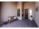 Covered entryway with tile flooring and a wooden bench at 41019 N Congressional Dr, Anthem, AZ 85086