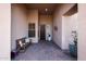 Covered entryway with tile flooring and a wooden bench at 41019 N Congressional Dr, Anthem, AZ 85086