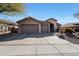 Two-car garage and desert landscaping at 41019 N Congressional Dr, Anthem, AZ 85086