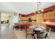 Bright kitchen with island, stainless steel appliances, and light wood cabinets at 41019 N Congressional Dr, Anthem, AZ 85086