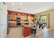 Kitchen with granite island, stainless steel appliances, and breakfast bar at 41019 N Congressional Dr, Anthem, AZ 85086