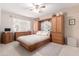 Spacious bedroom with a wooden platform bed and built-in storage at 4140 N 81St St, Scottsdale, AZ 85251