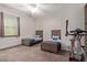 Bedroom with two twin beds and exercise bike at 41925 W Arvada Ln, Maricopa, AZ 85138