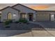 Single-story home with a two-car garage and landscaped front yard at 41925 W Arvada Ln, Maricopa, AZ 85138