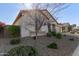 House exterior showcasing a tree and rock landscaping at 41925 W Arvada Ln, Maricopa, AZ 85138