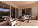 Relaxing patio with seating area and views of the pool at 41925 W Arvada Ln, Maricopa, AZ 85138