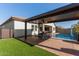 Covered patio with seating area and pool view at 41925 W Arvada Ln, Maricopa, AZ 85138