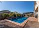 Inviting backyard pool with a spacious patio at 41925 W Arvada Ln, Maricopa, AZ 85138