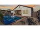 Inviting swimming pool with a spacious patio and backyard at 41925 W Arvada Ln, Maricopa, AZ 85138