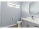 Small bathroom with gray vanity, toilet and mirror at 4444 N 25Th St # 1, Phoenix, AZ 85016