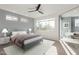 Relaxing bedroom with a large window view, comfortable bed, and a dedicated workspace at 4444 N 25Th St # 1, Phoenix, AZ 85016