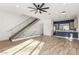 Open living room with modern staircase and hardwood floors at 4444 N 25Th St # 1, Phoenix, AZ 85016