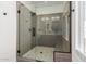 Walk-in shower with gray tile, glass enclosure, and built-in seat at 4444 N 25Th St # 1, Phoenix, AZ 85016