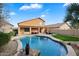 Relaxing backyard oasis featuring a sparkling pool and spacious patio at 45583 W Sheridan Rd, Maricopa, AZ 85139