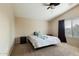 Spacious bedroom with carpeted floor and ceiling fan at 45583 W Sheridan Rd, Maricopa, AZ 85139