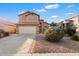 Two-story house with a landscaped yard and a two-car garage at 45583 W Sheridan Rd, Maricopa, AZ 85139