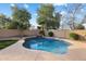 Inviting kidney-shaped pool with waterfall feature at 45583 W Sheridan Rd, Maricopa, AZ 85139