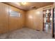 Bedroom with wood paneling, closet, and view of hallway at 530 S Alma School Rd # 75, Mesa, AZ 85210