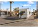 Mobile home with carport and palm trees at 530 S Alma School Rd # 75, Mesa, AZ 85210