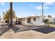 Single-wide manufactured home with carport and paved driveway at 530 S Alma School Rd # 75, Mesa, AZ 85210