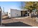 Mobile home with carport and gravel parking area at 530 S Alma School Rd # 75, Mesa, AZ 85210