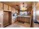 Retro kitchen with wood cabinets and built-in appliances at 530 S Alma School Rd # 75, Mesa, AZ 85210