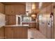 Wood kitchen cabinets, gas stove, and built-in oven at 530 S Alma School Rd # 75, Mesa, AZ 85210