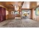 Living room with kitchen, sliding glass doors, and window at 530 S Alma School Rd # 75, Mesa, AZ 85210