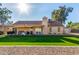 Home's back elevation, showcasing a large yard at 5448 W Shaw Butte Dr, Glendale, AZ 85304