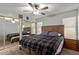 Cozy bedroom with a large bed and mirrored closet doors at 5448 W Shaw Butte Dr, Glendale, AZ 85304