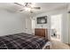 Comfortable bedroom with a dresser and a view of the hallway at 5448 W Shaw Butte Dr, Glendale, AZ 85304