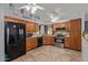 Bright kitchen with stainless steel appliances and wood cabinets at 5448 W Shaw Butte Dr, Glendale, AZ 85304