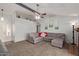 Spacious living room with gray sectional sofa and fireplace at 5448 W Shaw Butte Dr, Glendale, AZ 85304